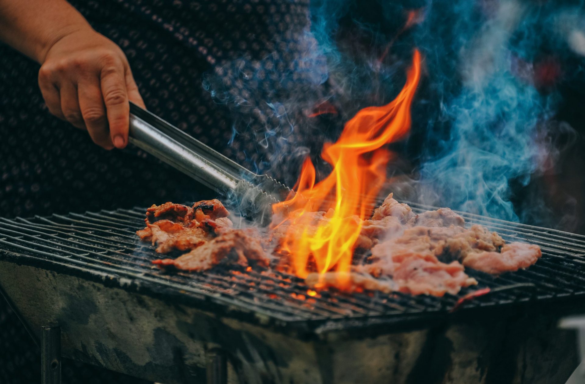 close-up-photo-of-man-cooking-meat-1482803